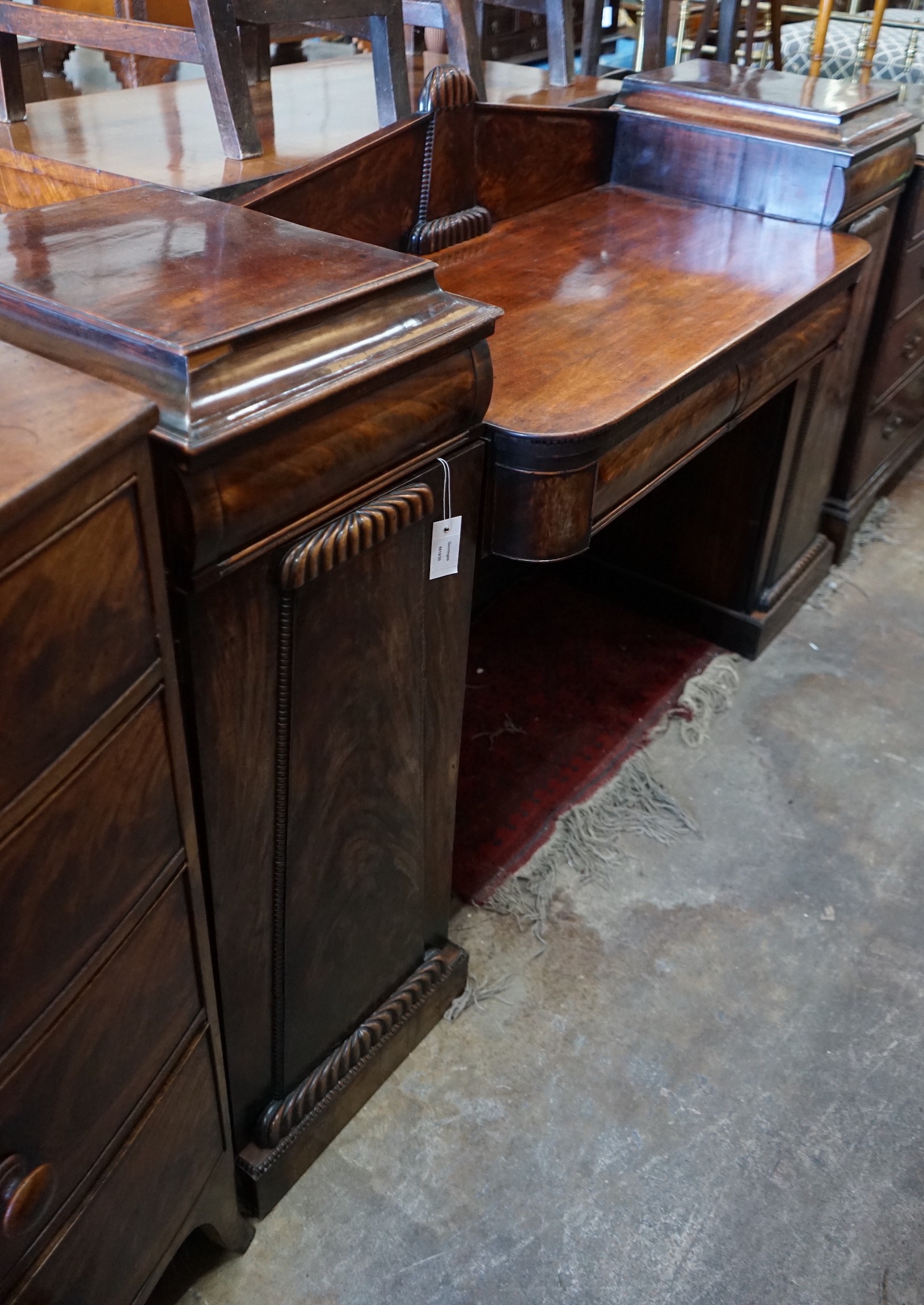 A Regency carved mahogany pedestal sideboard, length 186cm, depth 54cm, height 115cm